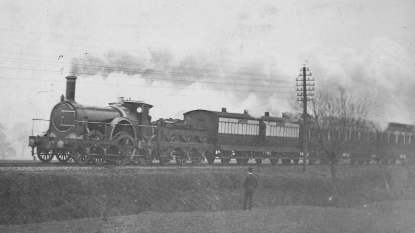 Victorian Express train journey showcasing historic locomotive and passengers in period attire for a scenic countryside ride