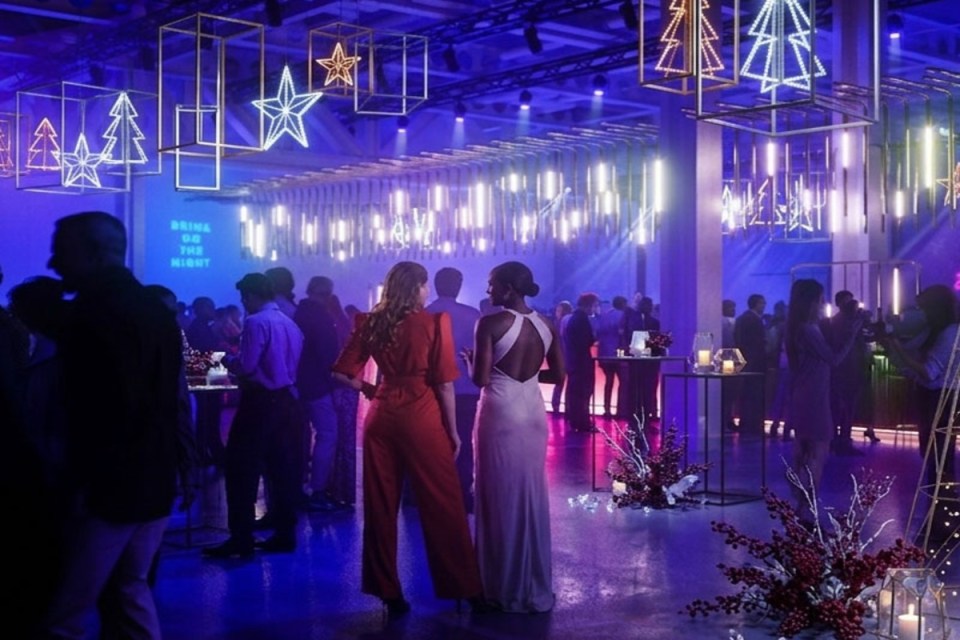 Festive Christmas decorations adorning West Hall with twinkling lights and holiday ornaments in a business setting
