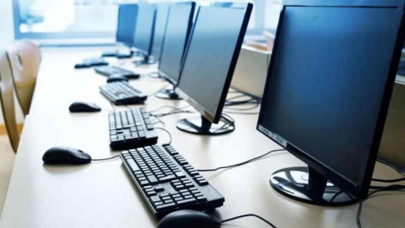 Modern office setup with a sleek computer on a desk, showcasing the latest technology trends in a professional workspace.