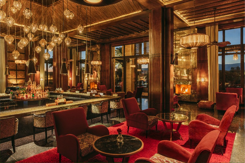Elegant Fairmont Marrakesh bar interior with luxurious seating, ambient lighting, and a sophisticated atmosphere for guests