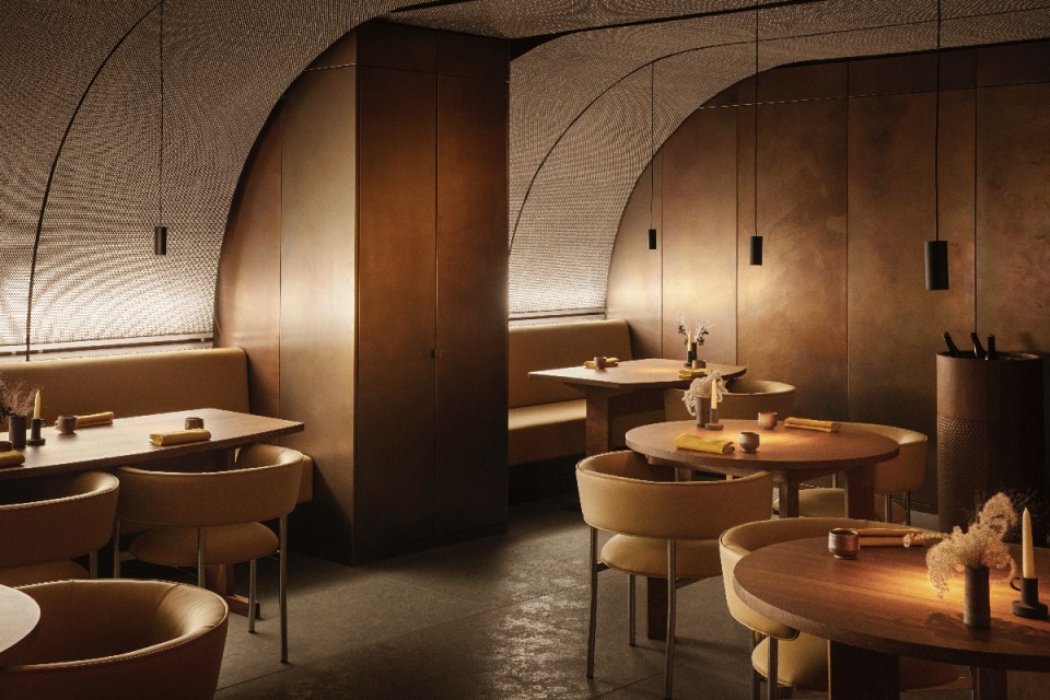 Elegant interior of Ikoyi restaurant showcasing modern design with upscale dining setup in a luxurious ambiance.