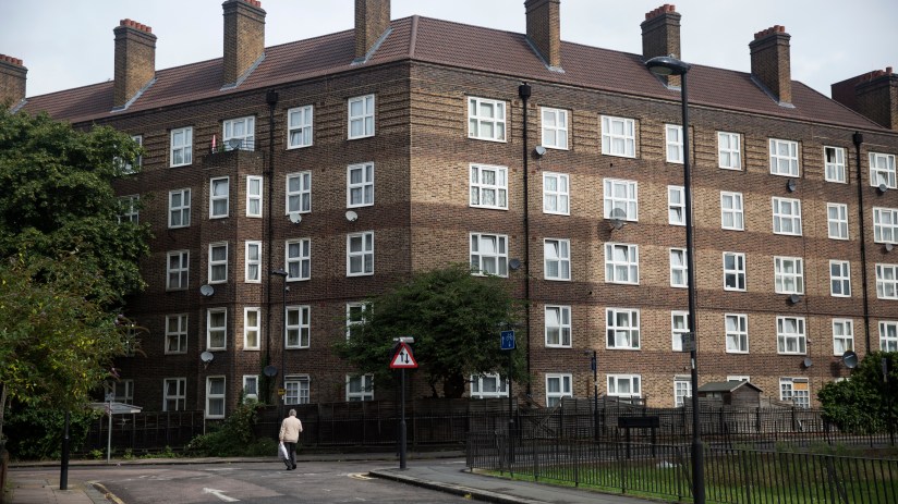 Modern apartment buildings representing social housing initiatives in urban development, highlighting sustainable architec...