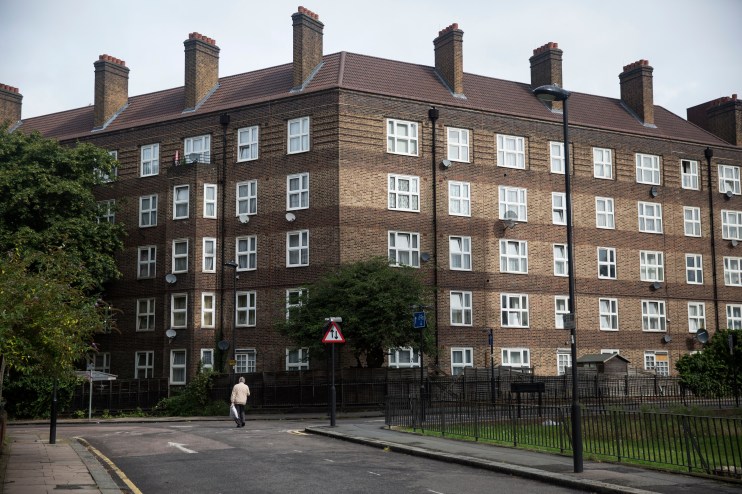 Modern apartment buildings representing social housing initiatives in urban development, highlighting sustainable architec...