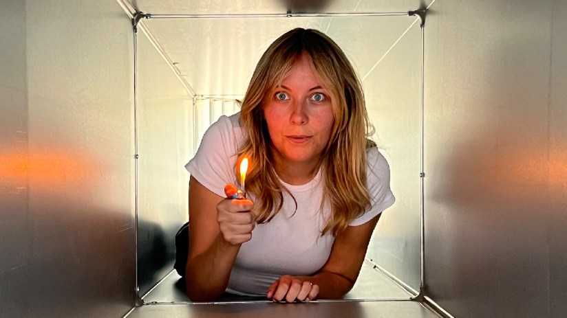 Amelia crawling through ventilation shaft, reminiscent of iconic Die Hard scene, highlighting TV tropes in action films.