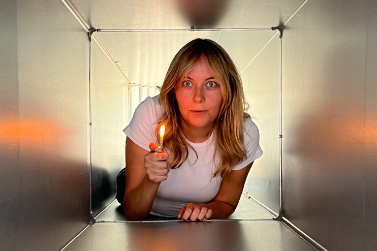 Amelia crawling through ventilation shaft, reminiscent of iconic Die Hard scene, highlighting TV tropes in action films.