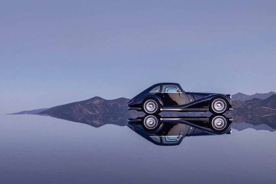 Morgan Midsummer Coupe in stunning profile, showcasing sleek design and craftsmanship on a scenic drive