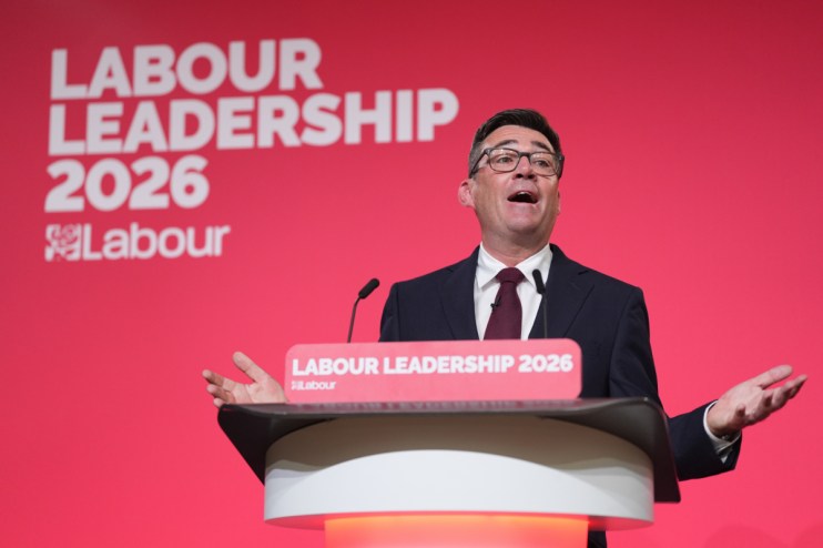 Andy Burnham speaking at Labour leadership event, addressing the audience with confidence and engaging in political discou...