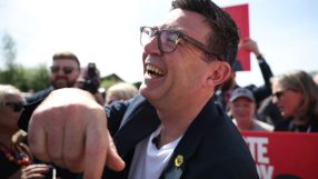 Andy Burnham laughing outdoors in a candid moment, May 2026, capturing a lighthearted political event atmosphere.
