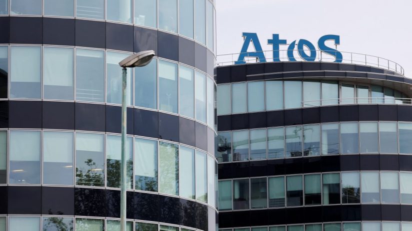 Atos logo prominently displayed on a modern office building, highlighting its corporate presence and technological expertise.