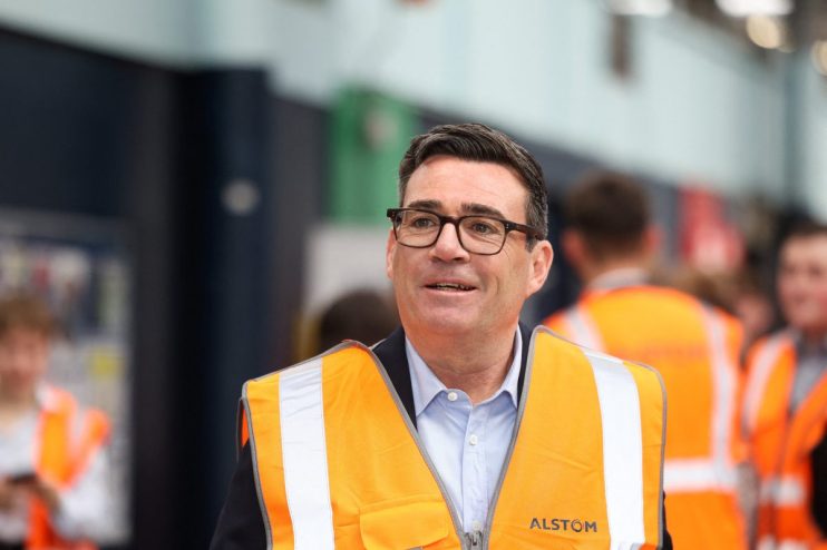 Andy Burnham, Mayor of Greater Manchester, in a high-vis vest at a technical education event.
