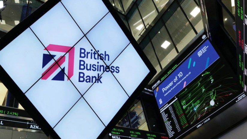 British Business Bank 10th anniversary celebration featuring executives, commemorative banners, and festive decor