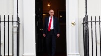 Chancellor John Healey speaking at a professional event, likely a press conference or address.