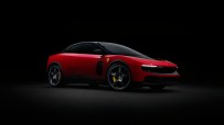 Red Ferrari Luce concept car with black roof and wheels, yellow brake calipers, against a dark background.
