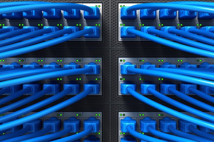 Close-up of vibrant fibre optic cables with glowing blue and green lights, symbolizing fast internet connectivity and data...