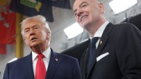 Donald Trump and FIFA President Gianni Infantino smiling, looking upwards during an event.