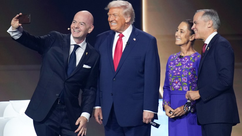 Gianni Infantino takes a selfie with Donald Trump, Claudia Sheinbaum, and a man in a suit.