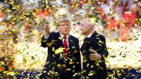 Donald Trump and Gianni Infantino surrounded by falling gold confetti at an event