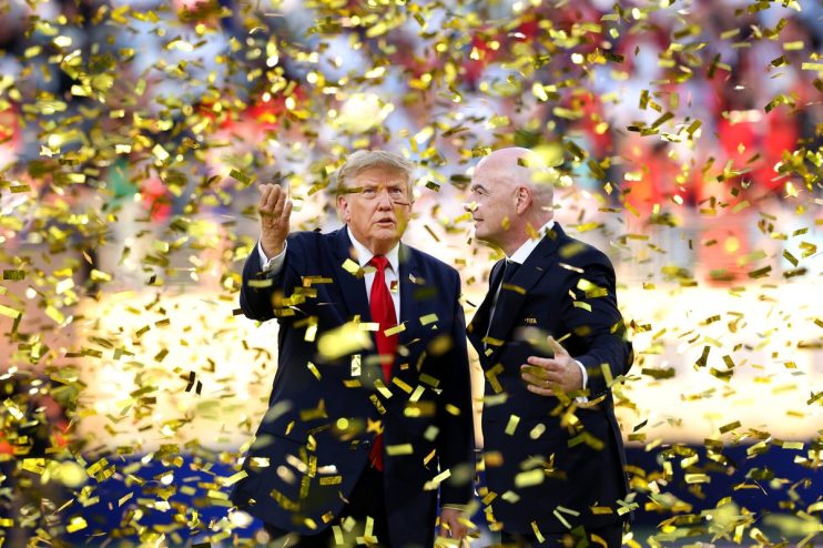 Donald Trump and Gianni Infantino surrounded by falling gold confetti at an event