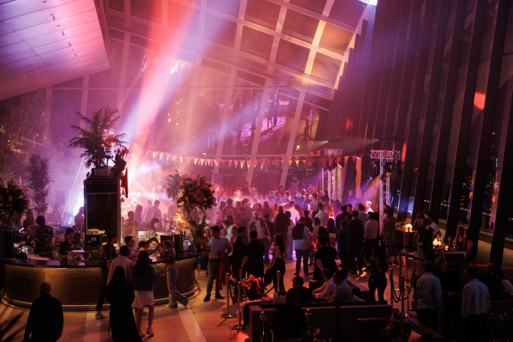 Guests enjoying vibrant Havana Sky Garden party with colorful decorations and lively atmosphere