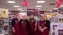 Hobbycraft store interior showcasing colorful craft supplies and materials neatly arranged on shelves for creative enthusi...