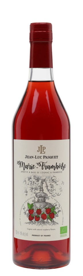 Jean Luc Pasquet Marie Framboise bottle with elegant label design on a wooden table in a well-lit tasting room.