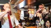 John Healey and Andy Burnham sampling beers at a pub bar