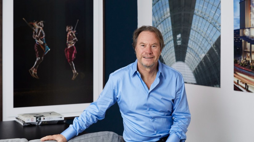 John Hitchox, founder of YOO Group, in a professional setting discussing innovative design and architecture strategies.