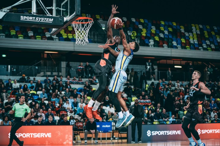 London Lions basketball team in action during a game, showcasing dynamic play and teamwork on the court.