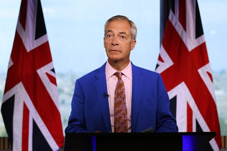 Nigel Farage speaking at a podium during a press conference, addressing current political issues and public concerns