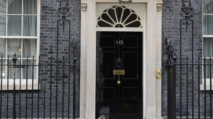 Number 10 Downing Street entrance with iconic black door, symbolizing British political power and leadership