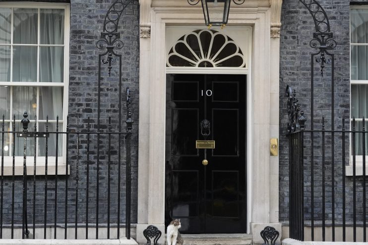 Number 10 Downing Street entrance with iconic black door, symbolizing British political power and leadership