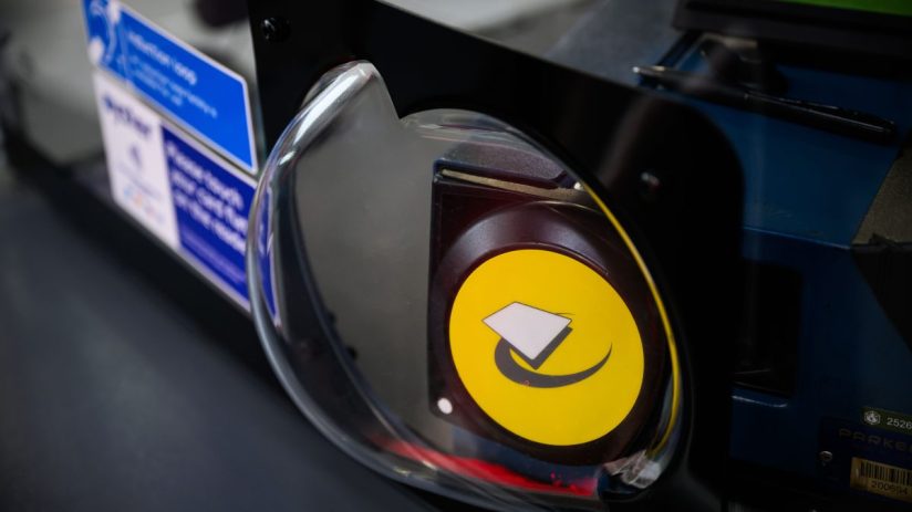 Close-up of a blue Oyster card against a white background, highlighting its role in public transportation payment systems.