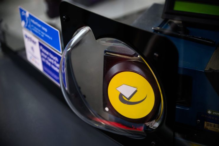 Close-up of a blue Oyster card against a white background, highlighting its role in public transportation payment systems.