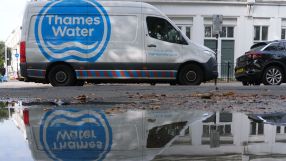 Thames Water infrastructure with pipes and maintenance workers, highlighting water management efforts in London