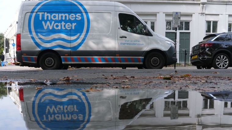Thames Water infrastructure with pipes and maintenance workers, highlighting water management efforts in London