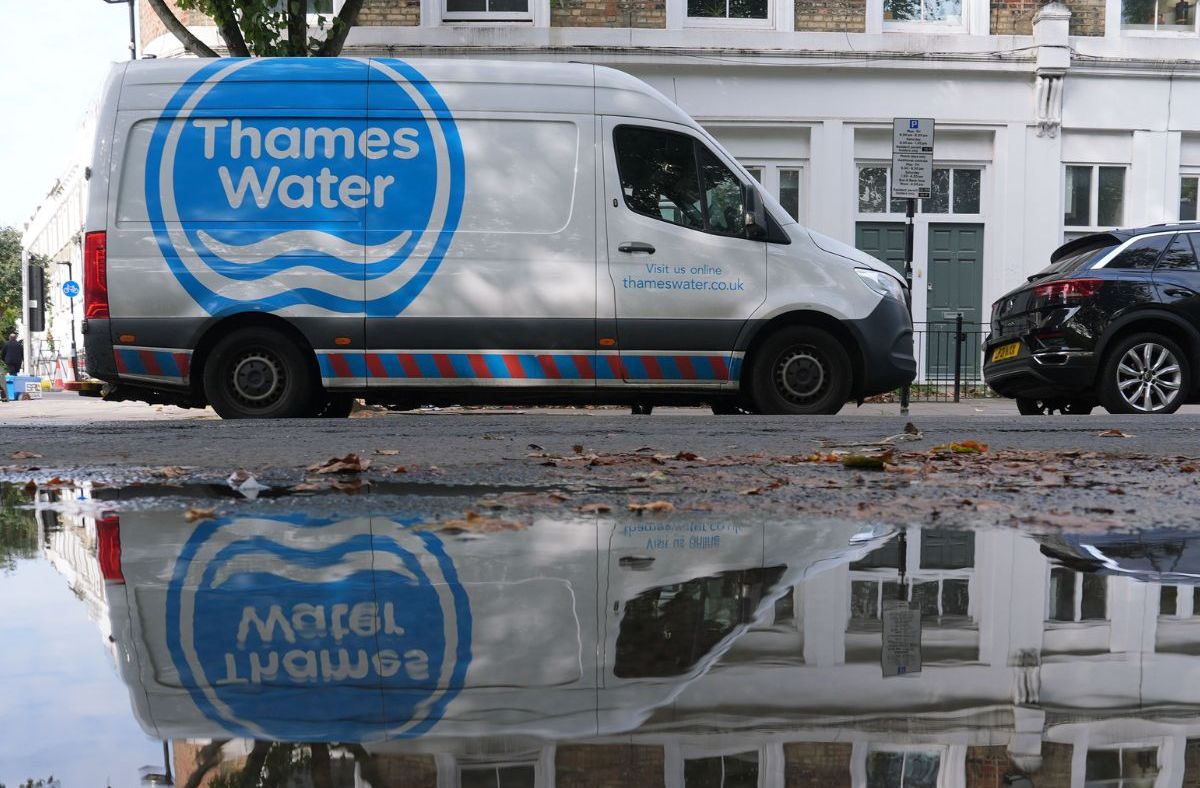 Thames Water infrastructure with pipes and maintenance workers, highlighting water management efforts in London