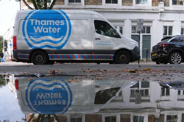 Thames Water infrastructure with pipes and maintenance workers, highlighting water management efforts in London