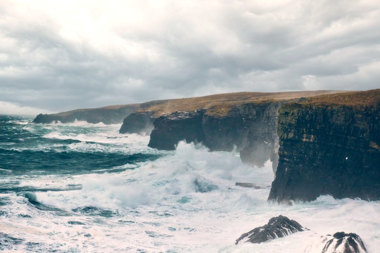 Scenic view of the Cliffs of Caithness, highlighting the rugged coastline near Old Pulteney distillery in Scotland.