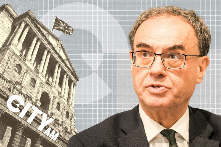 Andrew Bailey, Governor of the Bank of England, with the Bank of England building and Union Jack flag in the background