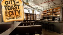 CITY AM Toast the City Awards 2026 logo superimposed over an upscale bar and restaurant interior.