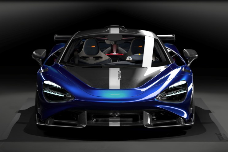 McLaren supercar on display, showcasing sleek design and advanced engineering against a backdrop of a bustling automotive ...