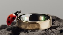 Close-up of Oura Ring 5 showcasing sleek design and advanced health tracking features in a tech-focused setting.