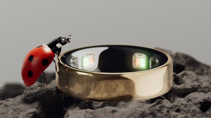 Close-up of Oura Ring 5 showcasing sleek design and advanced health tracking features in a tech-focused setting.