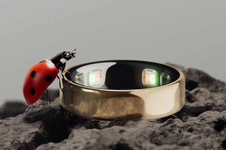 Close-up of Oura Ring 5 showcasing sleek design and advanced health tracking features in a tech-focused setting.