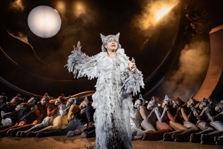 Grizabella in a shaggy white costume with cat ears, performing Memory from Cats musical at Regents Park Open Air Theatre