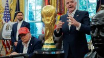 Gianni Infantino speaks near the FIFA World Cup trophy as Donald Trump sits, wearing a red Trump Was Right About Everythin...
