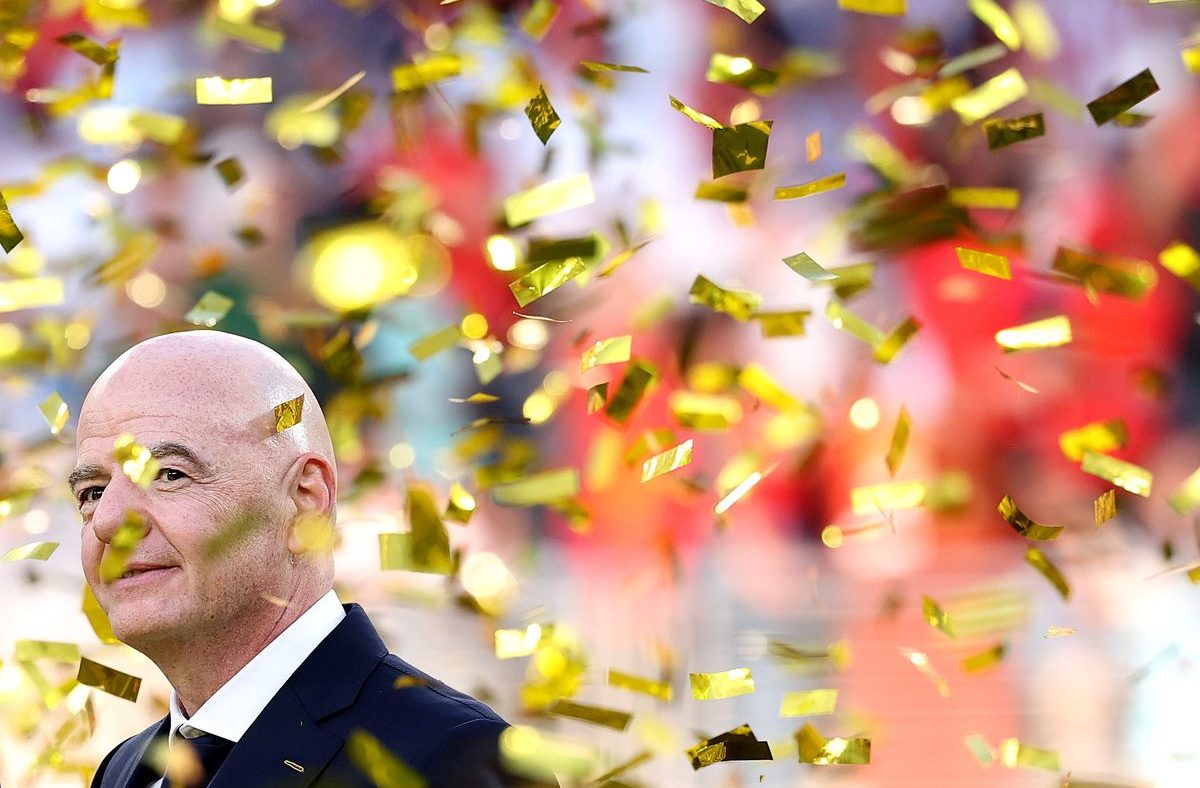 Gianni Infantino, FIFA President, smiling as golden confetti falls around him