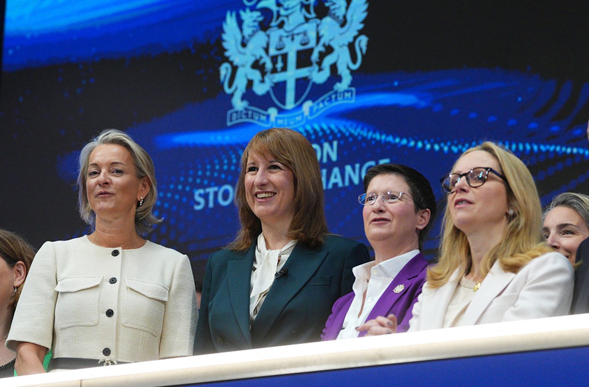 Julia Hoggett and Rachel Reeves with other women leaders at a financial event, discussing pension industry overhaul.