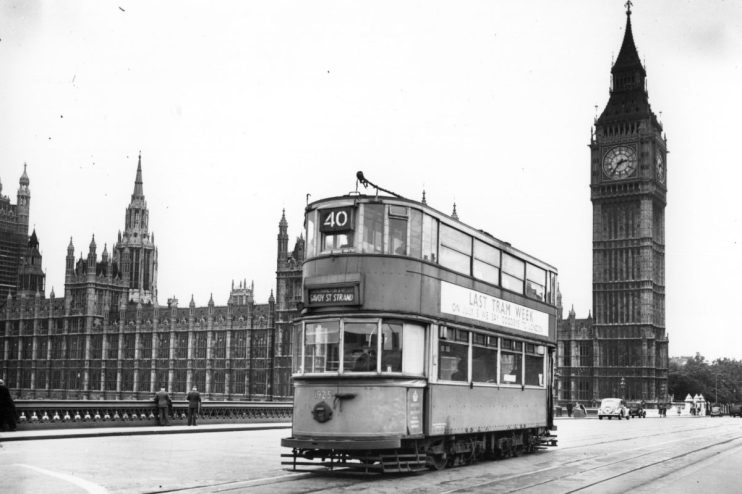 London tram 1925 with Last Tram Week sign in front of the Houses of Parliament and Big Ben, 1952.