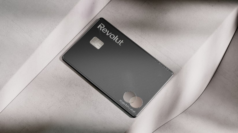 Revolut Mastercard debit card in black with textured lines on a light gray surface